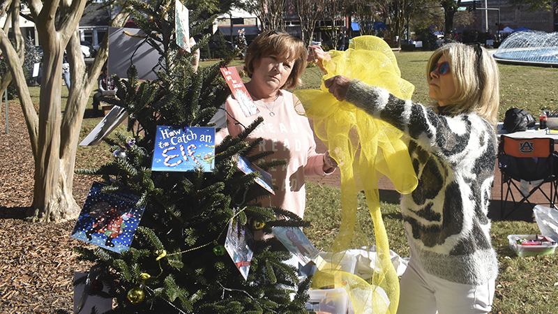 Kim Myers and Gail Gordon decorate the Get Troup Reading Tree -- Photo by Tommy Murphy